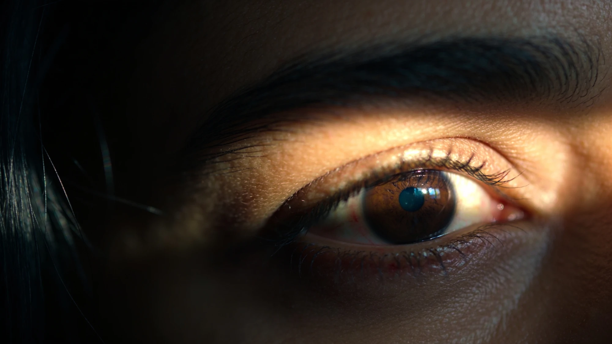 An eye in a bar of low light